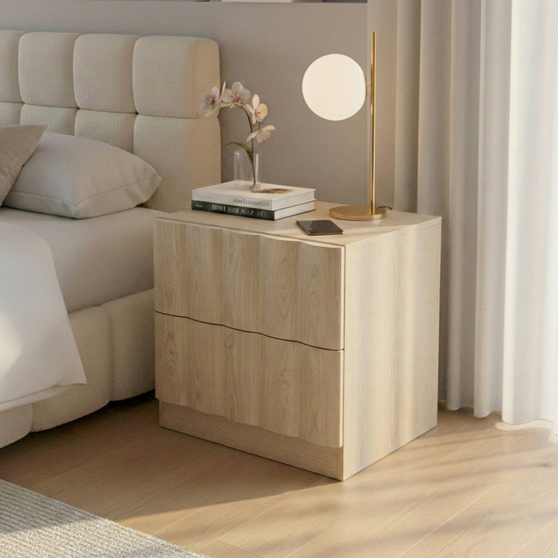 Wooden nightstand next to a bed with lamp and flowers in a modern bedroom