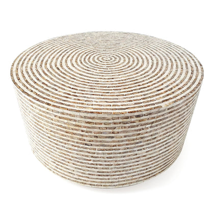 Round drum table with concentric mosaic pattern on white background