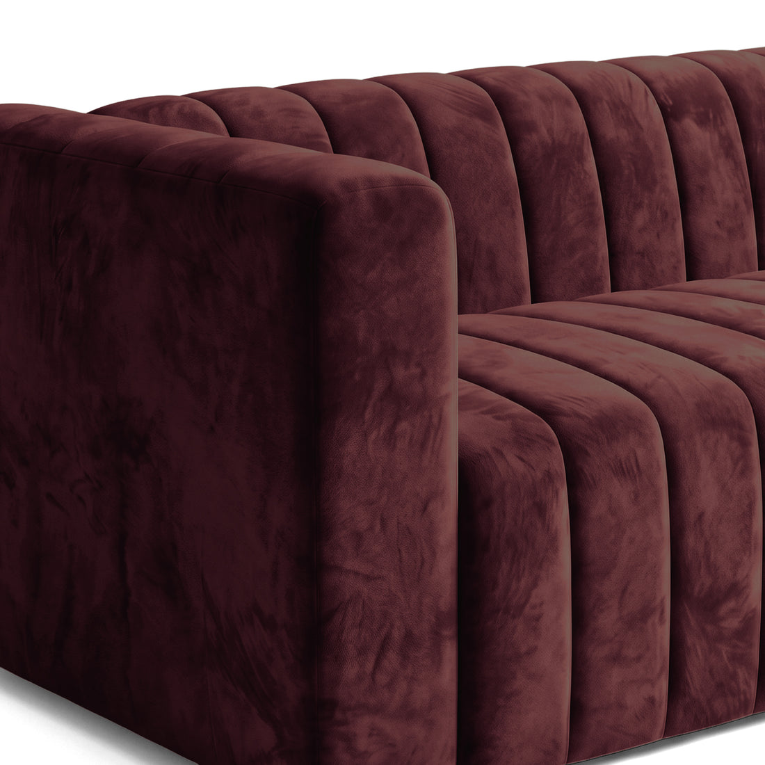 Angled partial view of a Dark Merlot sofa on a white background