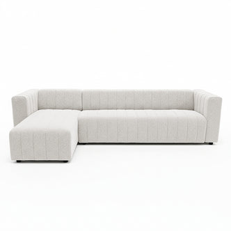 Parisa 4 Seater Tufted Boucle Sofa with Chaise in Cream White, featuring a modern L-shape, channel tufting, and low feet, offers a spacious chaise for lounging in style.