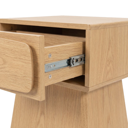 Close-up of a wooden nightstand drawer on a white background