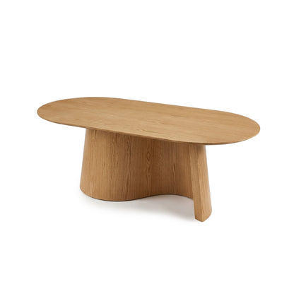 Modern wooden coffee table with oval top and asymmetric cylindrical base on white background