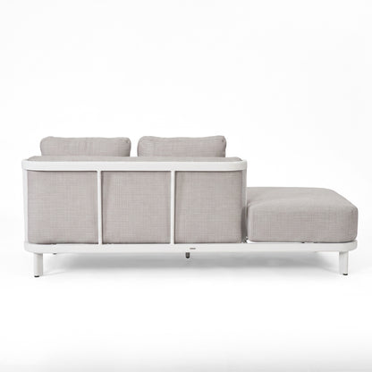 Light gray sectional sofa viewed from behind on a white background.