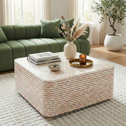 Rectangular coffee table styled in a living room with green sofa and rug