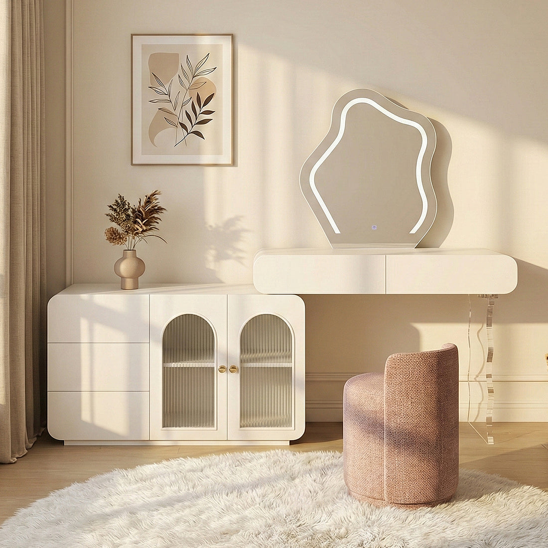Wavy-edged LED mirror and white console styled in a cozy, neutral-toned room