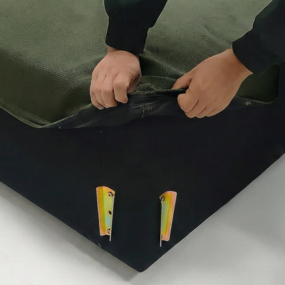 Hands adjusting zipper on dark sofa cover in lifestyle setting