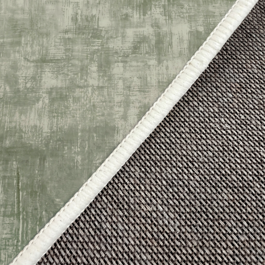 Close-up of rug corner showing texture, stitching, and underside