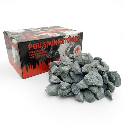 Pile of grey sauna stones in front of branded cardboard box on a white background