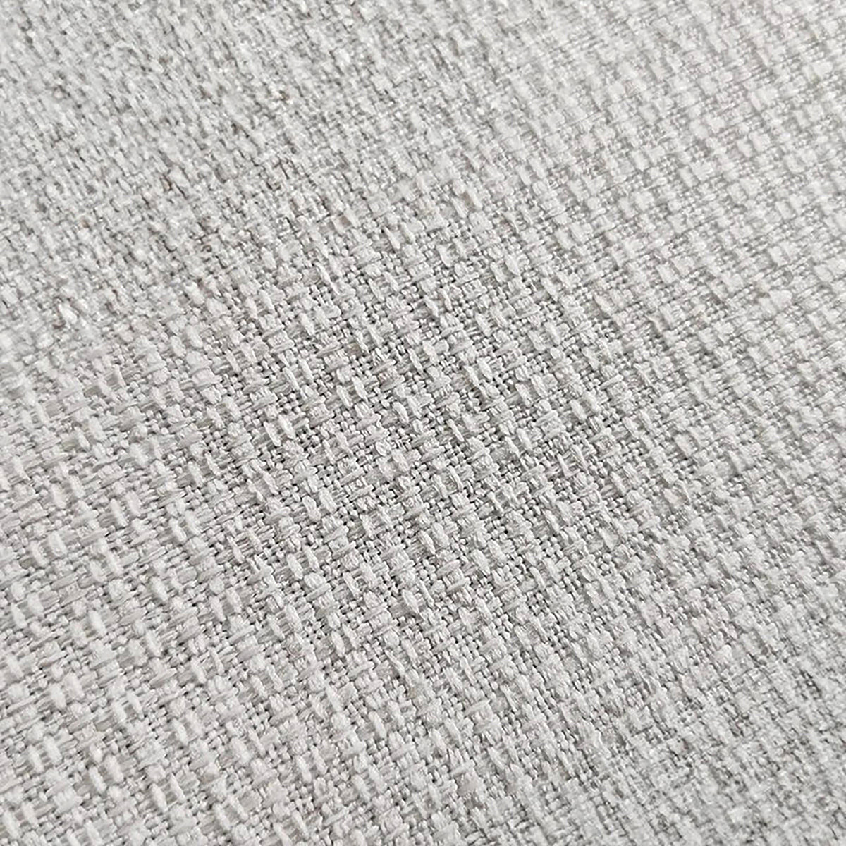 Close-up of textured beige upholstery fabric