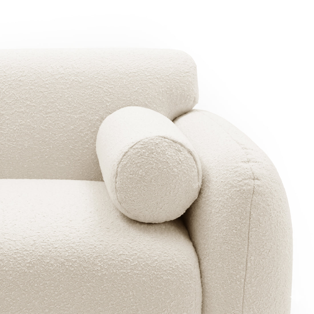 Close-up of sofa armrest and cylindrical bolster cushion on white background