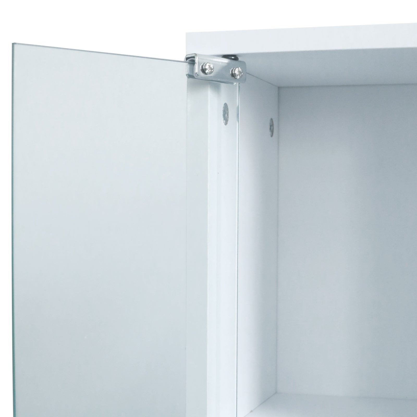 Close-up of mirrored cabinet hinge and interior corner