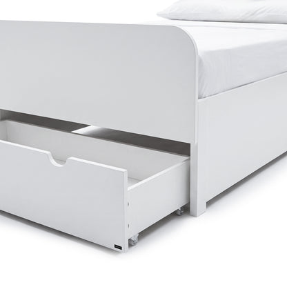 Close-up of the lower section of a white bed frame with an open storage drawer.