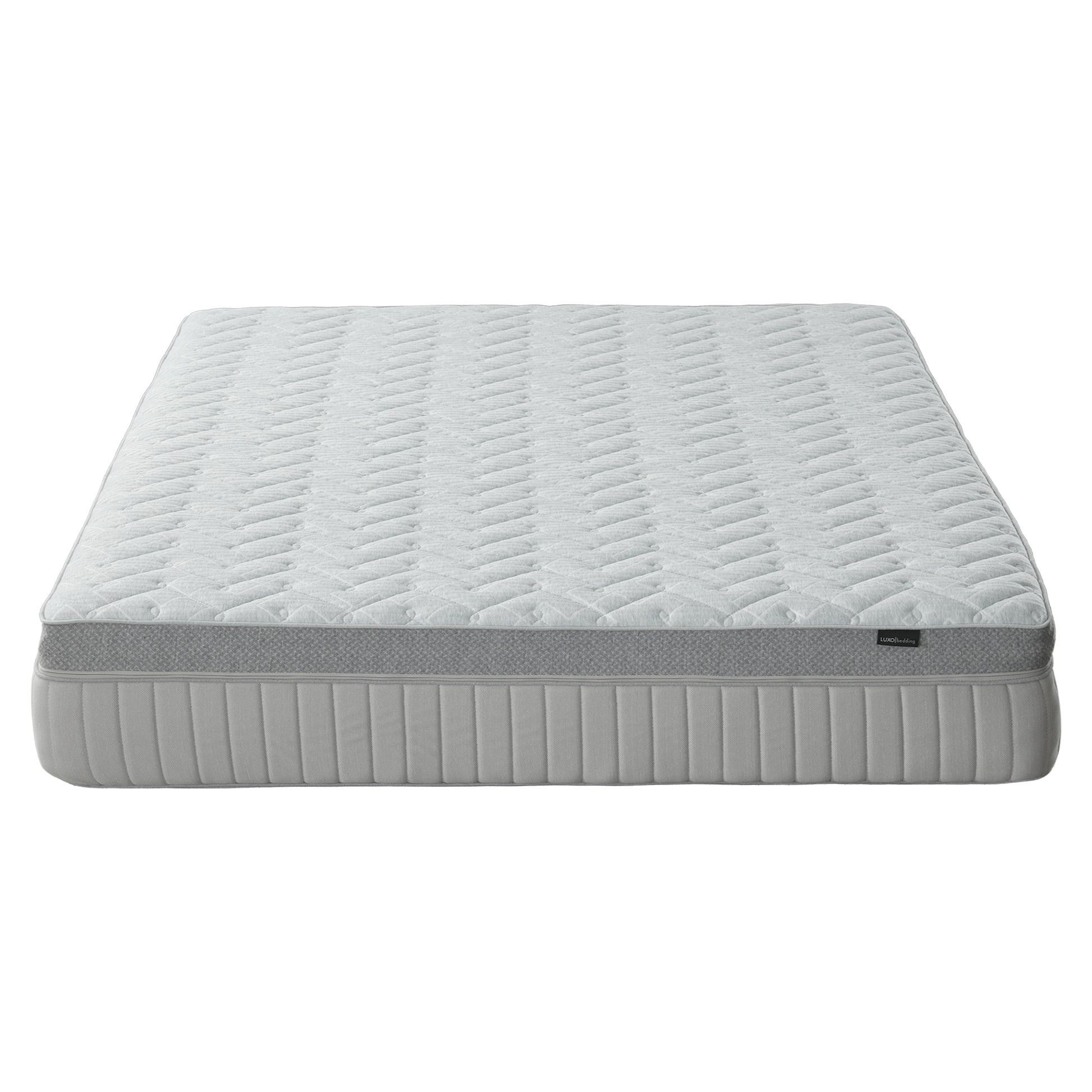 Mattress on white background shown nearly in full from a low angle