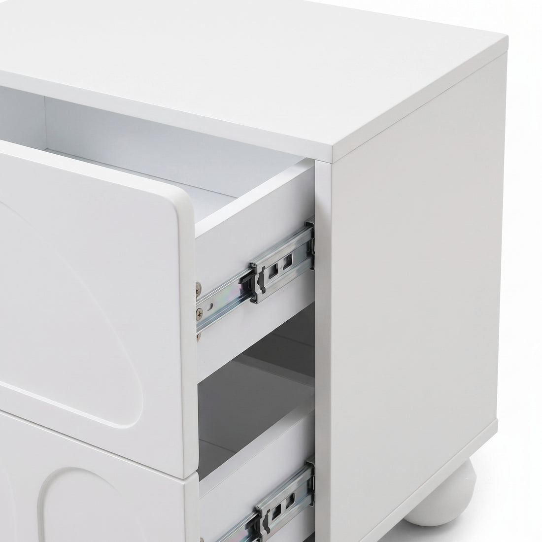 Partial view of a white modern nightstand showing the front and side with one drawer open.