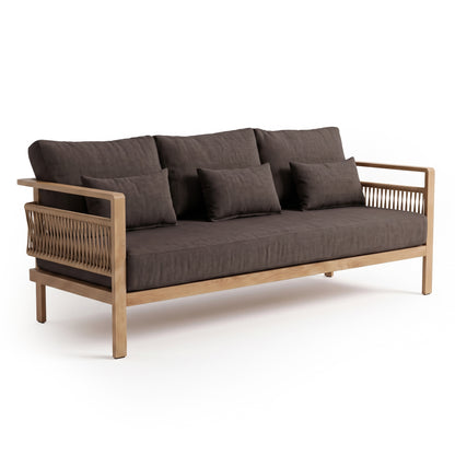 Side-angle view of a modern sofa with wood frame and woven side details on white background
