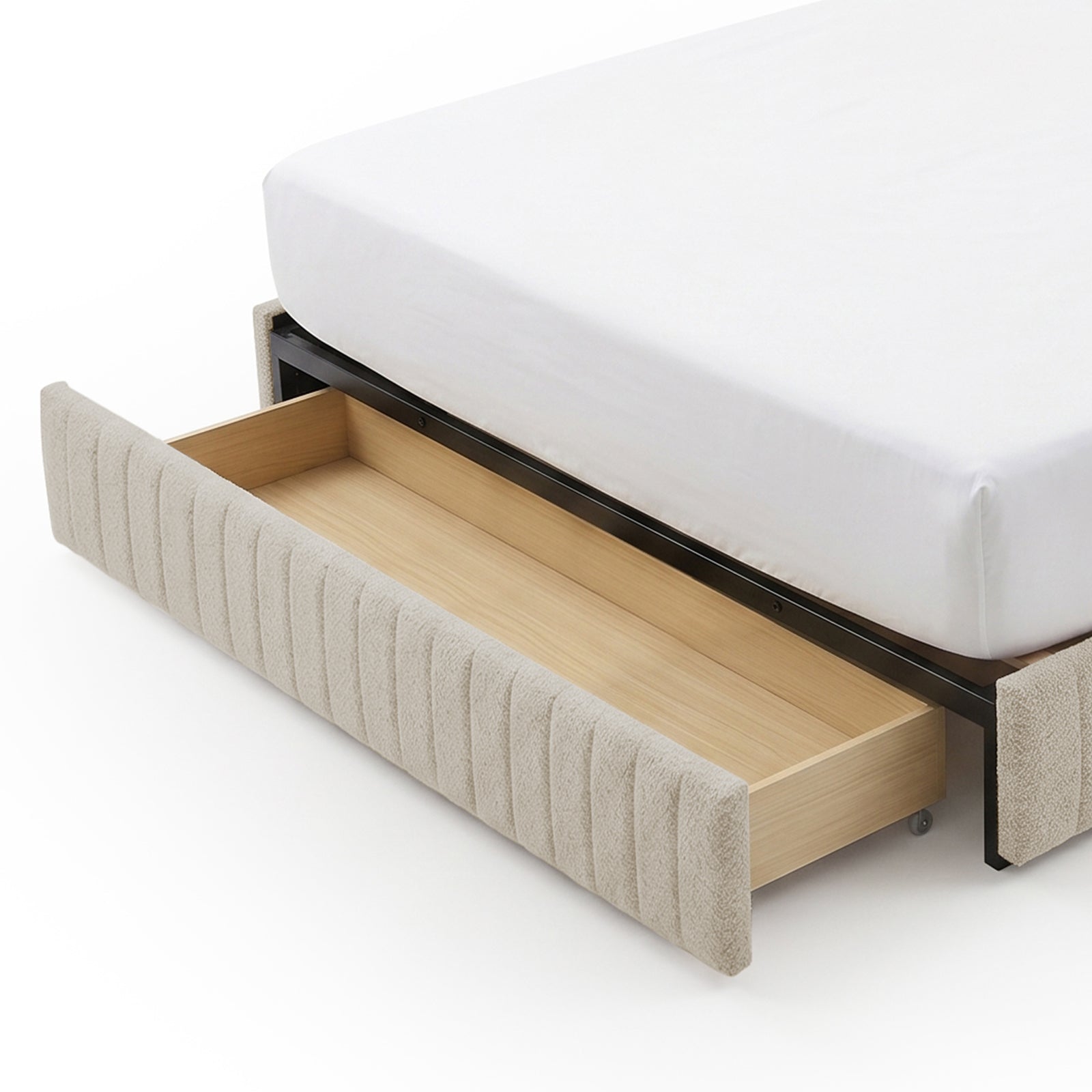 Detail view of bed frame drawer pulled out showing fabric front and wood interior