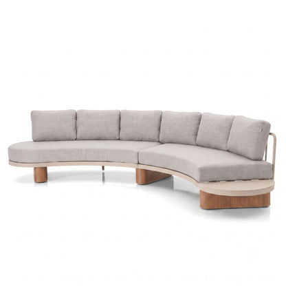 Modern curved sectional sofa with light gray cushions and wooden base on white background.