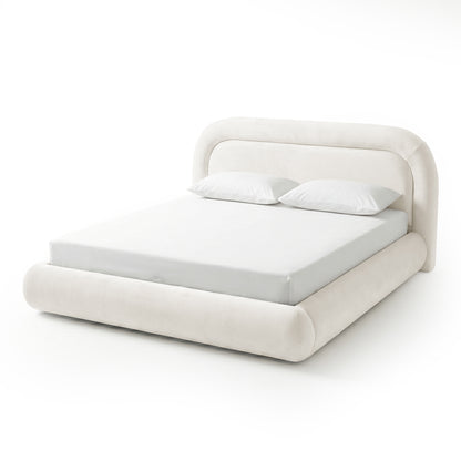 Elevated three-quarter view of a complete cream upholstered platform bed on a white background