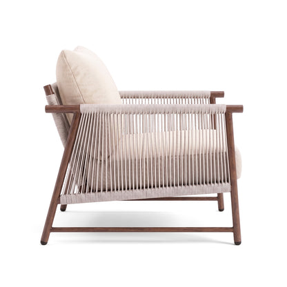 Side view of an armchair with wooden frame and rope details on white background