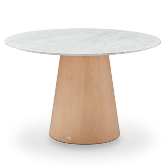 Dina 120cm Round Marble Dining Table in Carrara Natural with a white marble-look tabletop and a tapered light-wood pedestal base, designed for elegance and stability, enhancing dining spaces with luxury.