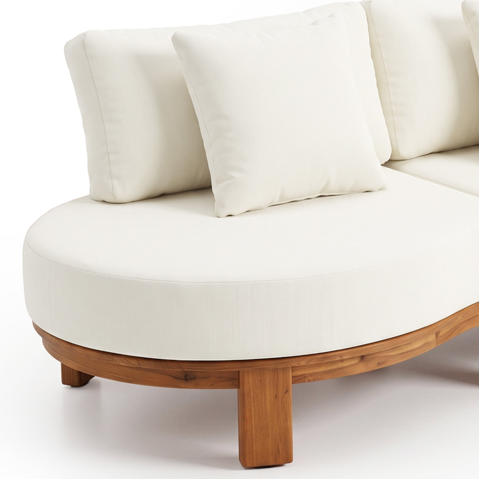 Partial view of a curved sectional sofa with white cushions and a wooden base on a white background.
