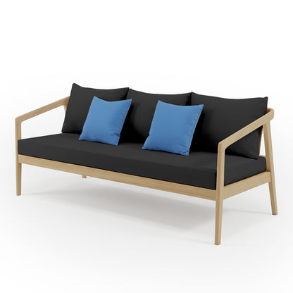 Delva 4 Seater Hardwood Acacia Outdoor Sofa Set in Black features a modern three-seat sofa with a light wood frame, dark fabric cushions, and bright blue throw pillows, showcasing a minimalist, open-leg design.