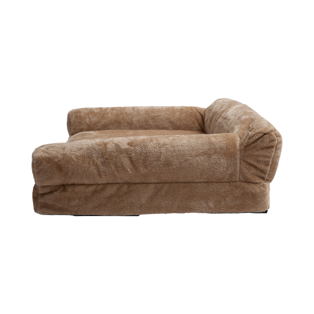 Side view of plush tan dog bed on white background