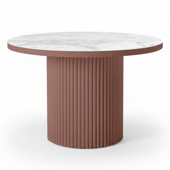 Evone Aluminium Outdoor Dining Table in Terracotta features a round white marble-look top and a fluted, cylindrical dusty-rose base, offering a contemporary, stylish look for outdoor spaces.