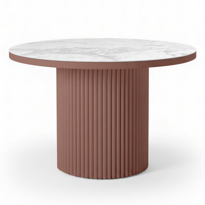 Evone Aluminium Outdoor Dining Table in Terracotta features a round white marble-look top and a fluted, cylindrical dusty-rose base, offering a contemporary, stylish look for outdoor spaces.