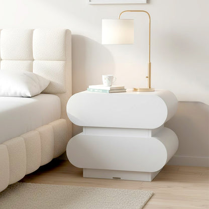 Ardenne 55cm Curved Bedside Table with Drawers in White, featuring a sculptural design with rounded edges, two drawers, and a gold-tone lamp, creating a serene, minimalist bedroom corner.