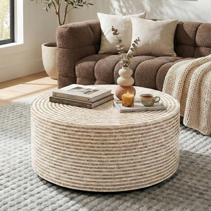 Round mosaic coffee table in a living room with sofa and decor