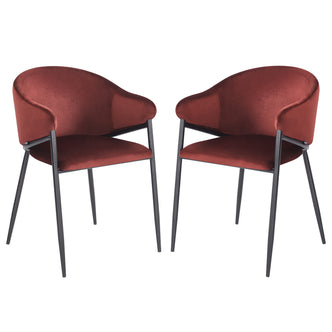 Pair of burgundy velvet chairs with black metal legs on white background