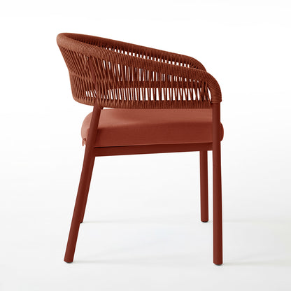 Coastal Outdoor Rope Dining Chairs Set of 2 in Burnt Orange featuring tubular-metal frame, padded seat, and wrap-around backrest with woven cord, showcasing modern design against a white backdrop.