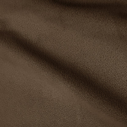 Close-up of textured dark brown upholstery fabric