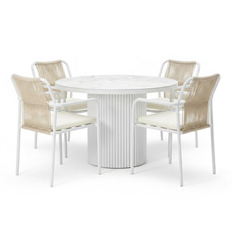 Evone 4 Seater Stone Outdoor Dining Table Set in Natural features a round, marble-look tabletop and four chairs with tan-rope backrests and light cushions, perfect for a modern patio.