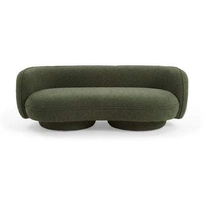 Modern dark green upholstered sofa on white background