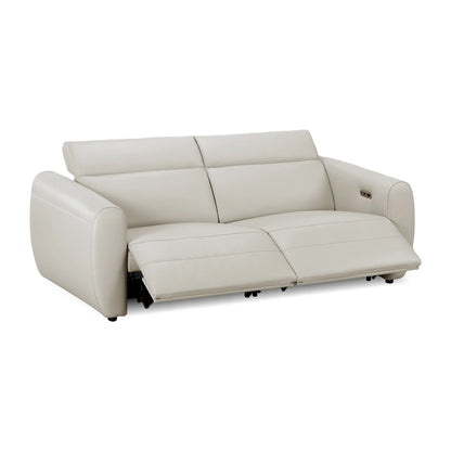 Cream leather recliner sofa with footrests extended against a plain white studio background.