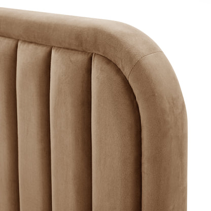 Close-up of upholstery detail and stitching on tan headboard