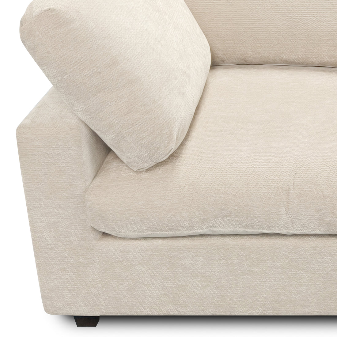 Partial view of beige upholstered sofa section on white background