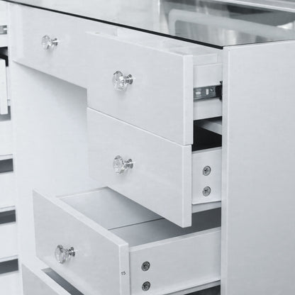 Partial view of white vanity chest of drawers in a room