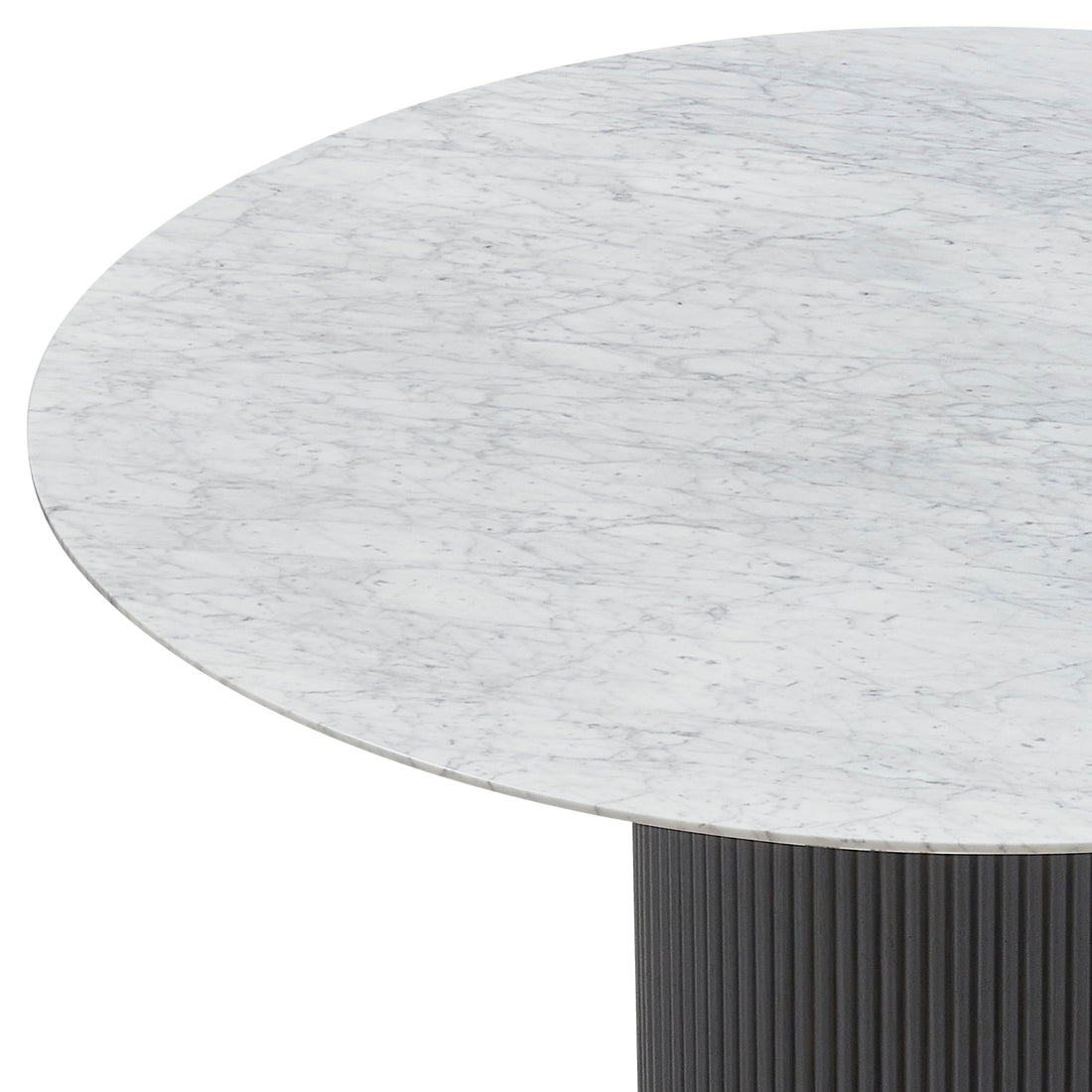 Gracie 120cm Round Marble Dining Table in Black showcases a white Carrara-style marble top with gray veining, supported by a dark, fluted pedestal base.