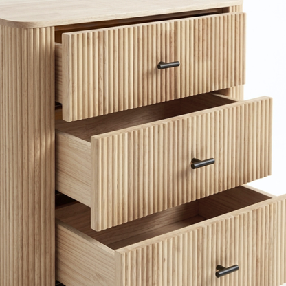 Light wood dresser with partially open drawers on a white background