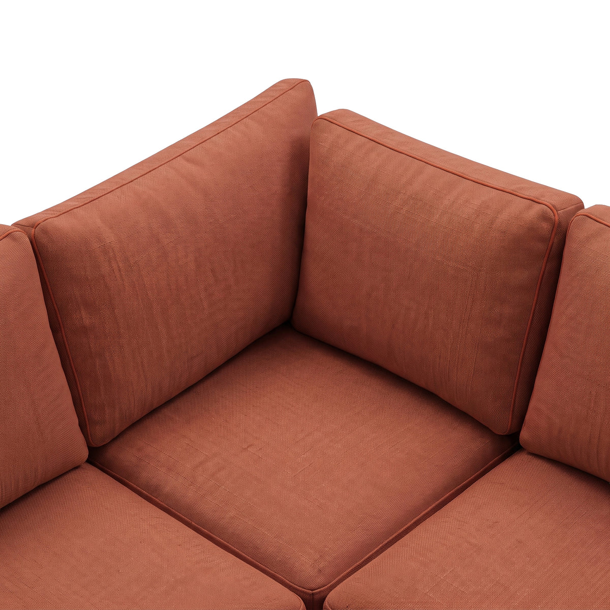 Close-up of terracotta sectional cushions and textured upholstery