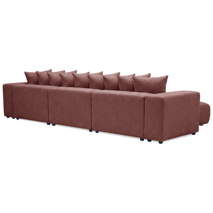 Angled rear view of long sectional sofa on white background