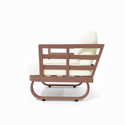 Paloma Modular Outdoor Lounge Set in Terracotta features a rust-brown metal frame with horizontal slats, off-white thick cushions, and a curved rocker-style base, ideal for stylish outdoor relaxation.
