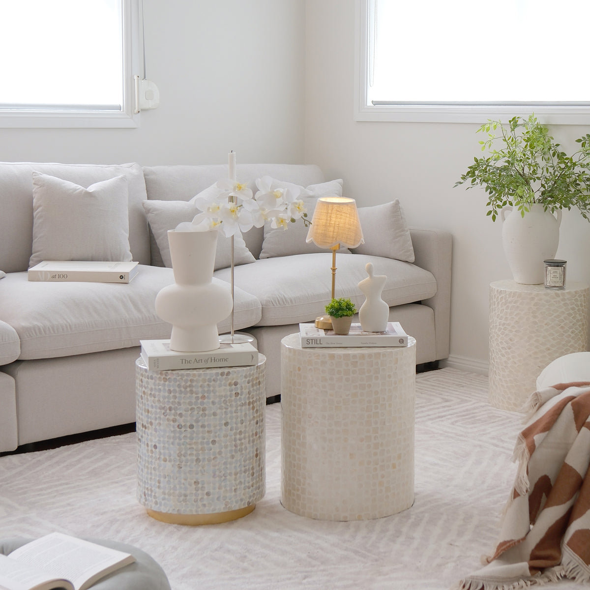 Round accent tables styled in a bright living room