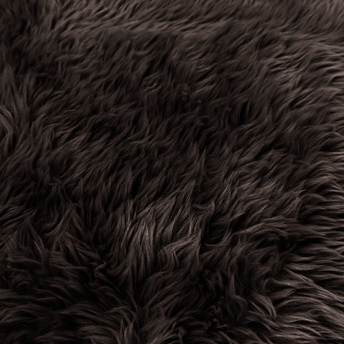 Extreme close-up of chocolate brown shaggy faux fur texture