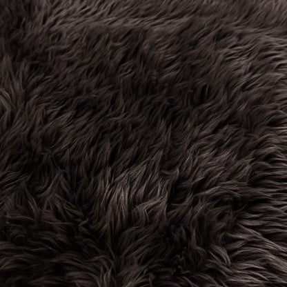 Extreme close-up of chocolate brown shaggy faux fur texture