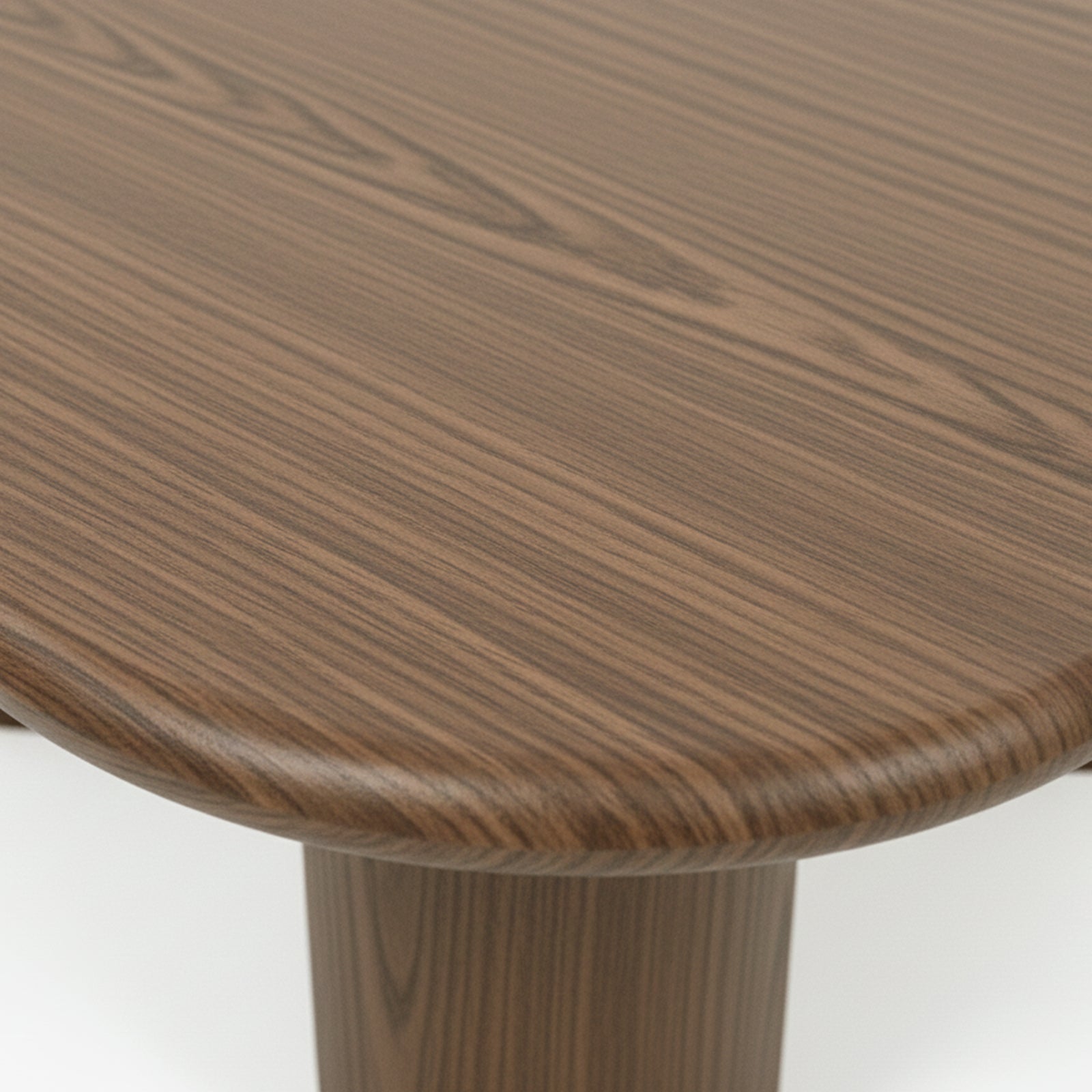 Detail of rounded wooden table corner showing grain pattern