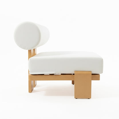 The image features the Modica 5 Seater Aluminium Outdoor Sofa Set in White, showcasing a minimalist daybed with a light-wood frame, thick white cushion, and bolster pillow for modern outdoor lounging.